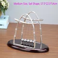 Medium size sail shape Newton's cradle with silver metal balls and red wooden base - Medium Sail-shape