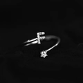 Minimalist silver letter F open ring with sparkling diamonds and a round center stone - Letter F