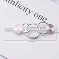 Silver geometric interlaced circle hair clip with spiral texture detail and size dimensions - Five Circles Silver