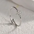 Macro shot of silver titanium octagonal star ring with pave-set clear gemstones - Octagram Open Ring / Silver