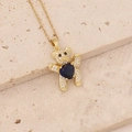 Detailed shot of teddy bear necklace with heart-shaped dark blue gem on stone - Teddy Bear Blue Heart Full Zircon (25#)