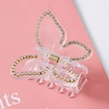 Detailed close-up of a butterfly hair claw clip with sparkling rhinestones on pink background - 8# Clear Shiny Rhinestone Butterfly Claw