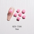 Macro shot of 8mm pink resin 3D rose nail art charm on a nude fake nail display - 8mm / Pink