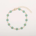 Golden bracelet with blue enamel daisies and adjustable chain on minimalist background - Sky Blue Daisy