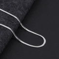 Macro shot of silver snake chain necklace showing flat structure and metallic gloss - Silver Blade Chain 4mm Wide 40+5cm