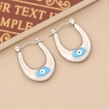 Detailed view of silver U-shaped hoop earrings with blue enamel evil eye design - 7# (Silver U-Shape Blue Eye)