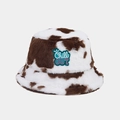Detailed close-up of cow print plush bucket hat with Chill OUT embroidered patch - One Size / Dark Brown Cow Print