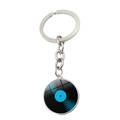 Macro view of a classic vinyl record charm keychain with blue accents and silver metal ring - Blue Record