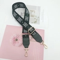Close-up of ethnic style dark green embroidered bag strap with golden metal hardware - Dark Green with Dark Green Leather