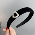 Detail of black velvet headband featuring a hollow zircon heart-shaped accent piece - Heart Rhinestone Style
