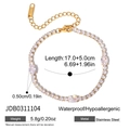 Detail van 18K vergulde tennisarmband met witte zirkoon druppels en roestvrij staal - Ovale Stijl (JDB0311104)