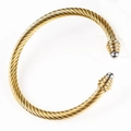 Macro detail of twisted cable texture and dual-tone gold and silver finish on open cuff bracelet - Gold-Steel Bead
