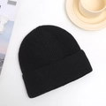 Close-up of black ribbed knit beanie texture showing detailed high-quality yarn pattern - One Size / Black