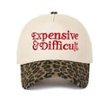 Close-up of red Expensive & Difficult embroidery on leopard print brim baseball cap - Cream/Leopard