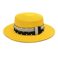 Detail of yellow straw sun hat featuring elegant pearl and rhinestone ribbon embellishment - Yellow