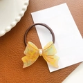 Elastico per capelli con fiocco in acetato giallo e perla su fondo in pelle - Scrunchie con Fiocco / Giallo Floreale - Elastico