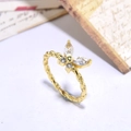 Detail of a gold butterfly ring featuring zircon pavé stones and a twisted band design - Gold Clear Zirconia Twisted Band Butterfly(ZYN-DMR118G-2)