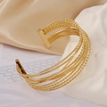 Detail view of 18k gold plated stainless steel multi-layer open cuff with textured wires - Granular Textured Style (1161-1)