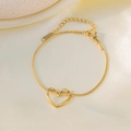 Elegant gold snake chain bracelet with minimalist hollow heart pendant and lobster clasp - E2215 Heart Bracelet Gold