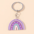 Rainbow acrylic keychain with purple stripes, white stars and black dots on a beige base - Purple Rainbow