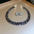 Macro view of vintage silver jewelry set with blue gemstones and sparkling diamonds - Silver Black