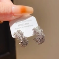 Macro shot of silver C-shape earrings with zircon inlay on a S925 silver product card - 925 Sterling Silver Earring Post - Silver C-Shape Half Hoop