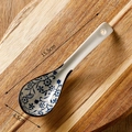 Blue floral pattern ceramic soup spoon with 15.5cm length on a wooden board - Round Floral