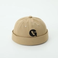 Close-up of khaki cotton brimless cap featuring a black embroidered G letter detail - Letter G - Khaki / 52cm (2-5 Years)