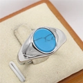 Minimalist silver titanium steel ring with oval turquoise gemstone on a jewelry stand - US 12 / Steel Blue Turquoise
