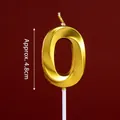 Golden number 0 birthday cake candle with metallic finish on a red background - Gold Diamond-faceted Number Candle 0
