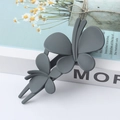 Elegant large dark grey matte butterfly hair clip with double layered design on display - Gray