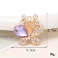 Dettaglio ravvicinato del ciondolo a farfalla viola con strass e placcatura in oro - D1252 Farfalla a Goccia d'Acqua Viola