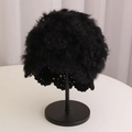 Detailed view of handmade crochet rabbit fur hat with knitted flowers in black - Black