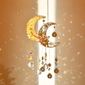 Macro detail of crescent moon suncatcher with citrine crystals and hanging crystal balls - Citrine