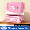 Pink 75% alcohol wipes in 20-count portable packs on a wooden surface for sanitizing - 20 Sheets Alcohol Wipes (Pink)