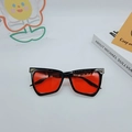Cat eye sunglasses with black frame, bold red lenses, and golden triangle corner accents - Black Frame Red Lens