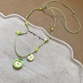 Collier avec pendentif pomme verte et étoile jaune sur cordon tressé et lin chic - Pomme Étoile Tissée en Cristal (20#)