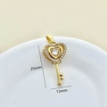 Golden heart-shaped key pendant set with white zircon stones measuring 25mm by 13mm - Gold-Key