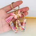 Detail of resin letter W keychain with colorful heart sequins, pink butterfly and tassel - Butterfly Tassel 8-Shape Buckle / Letter W