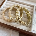 Detailed close-up of gold and cream beaded elastic bracelets set in a luxury wooden jewelry box - 10# Beaded Bracelet (HB4558)