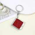 Detailed view of red square rhinestone keychain with silver metal chain and spring clasp - Red