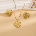 Detail of gold heart necklace and earrings set with elegant striped texture - Striped Heart Style (E6210-7)