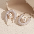 Detailed view of U-shaped mesh earrings with faux pearl on elegant stone background - Silver Needle - Silver Pearl