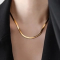 Elegant gold snake bone chain necklace shown on a model with a black suit blazer - Length 40+5cm / Gold