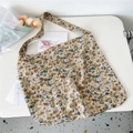 Detail of corduroy tote bag with small floral patterns on a minimalist white desk - Light Blue Floral