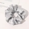 Macro detail of silver-grey silk satin scrunchie with soft sheen on white background - Silver Grey