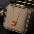 Orange enamel H-letter pendant necklace with gold plating on brown jewelry box - Orange H Letter Pendant (8803H) / Rose Gold
