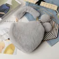 Detail of gray heart-shaped faux fur bag with golden chain and soft pompom charms - Light Gray