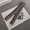 Detail of adjustable woven wide shoulder strap with blue checkered pattern and gold hardware - Dark Grey Blue + Gold Hook