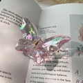 Pink iridescent butterfly hair claw clip with holographic resin finish and metal spring - Phantom Pink